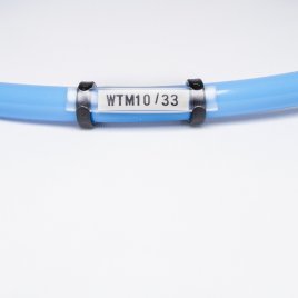 WTM 10 / 33 Oznacznik kablowy na etykietę płaską PP*45 wys.4,5 mm dł. 33 mm op.100 szt